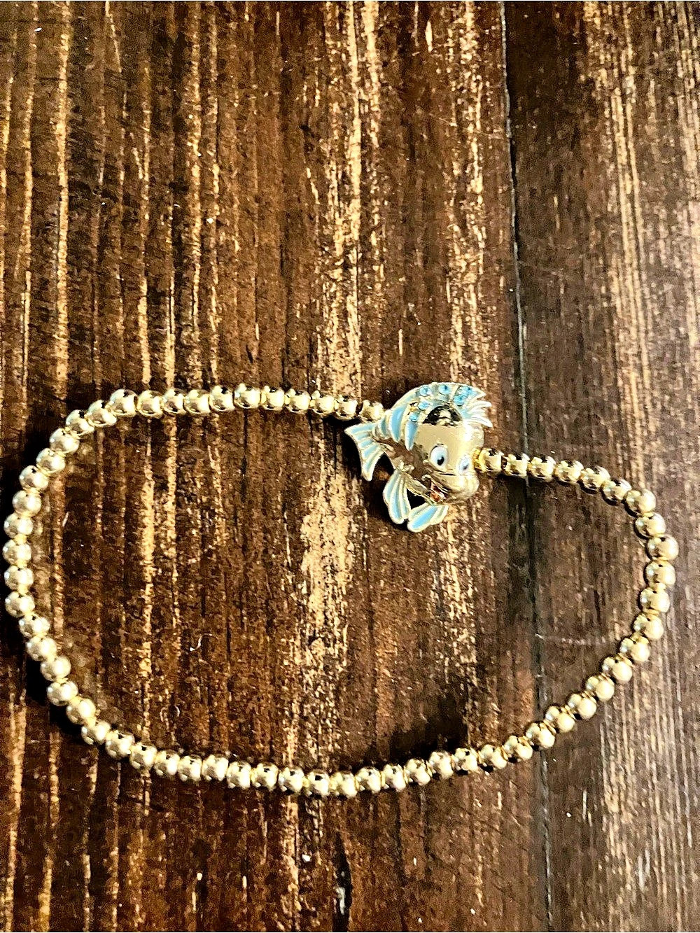 BaubleBar Disney Beaded stretchy bracelet in Gold & Blue